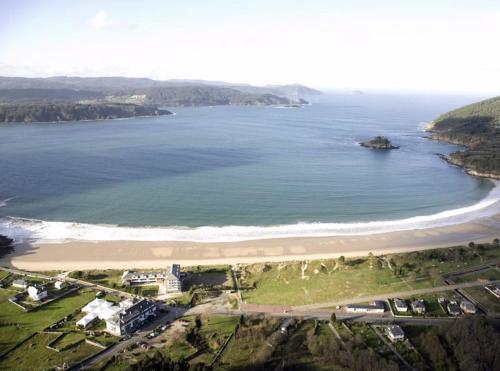 an aerial view of a beach and the ocean at Cabaña rústica playa Area, Viveiro, Lugo in Lago