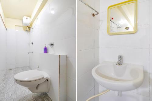 a white bathroom with a toilet and a sink at FabHotel I Residency - Nr St Johns Medical College in Bangalore