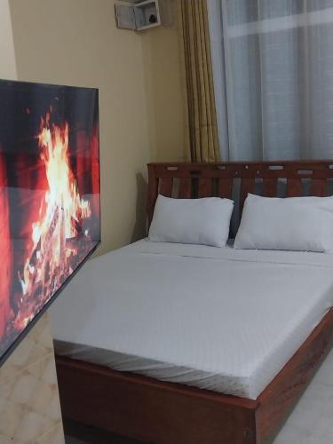 Una cama o camas en una habitación de Amore cosy studio mtwapa