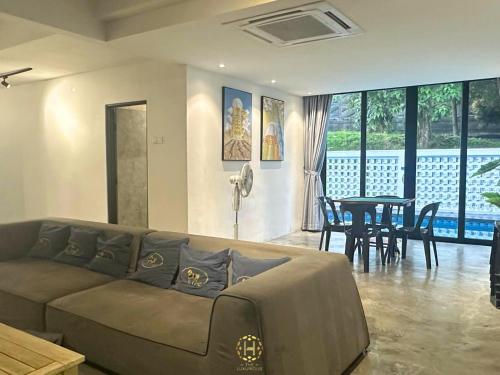 a living room with a couch and a table at The Luxurious 27, Johor Bahru in Johor Bahru