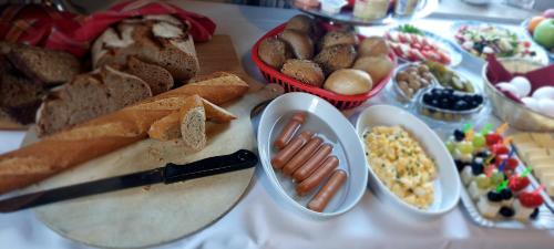 a table with a bunch of different types of food at Hotel Hülsmann Garni in Niedersachsen-Stadland