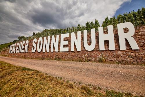 a large sign on a wall on a dirt road at Neu!!! Moselbleibe Altes Forsthaus in Bernkastel-Kues