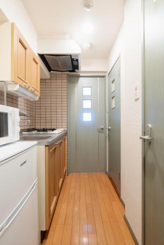 Kuchyň nebo kuchyňský kout v ubytování Atlas Apartment