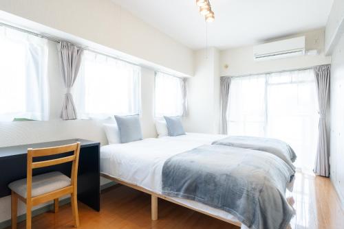 Postel nebo postele na pokoji v ubytování Atlas Apartment