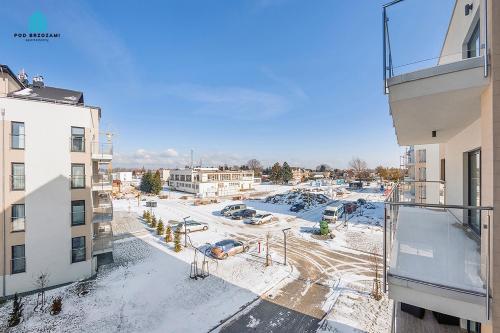 an aerial view of a parking lot in a city at Pod Brzozami Apartamenty 5 Mórz in Ustronie Morskie