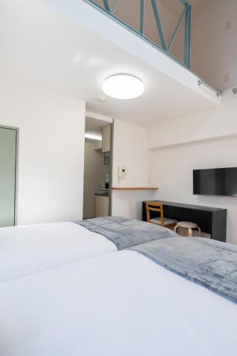 Postel nebo postele na pokoji v ubytování Atlas Apartment