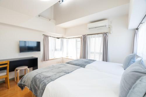 Postel nebo postele na pokoji v ubytování Atlas Apartment