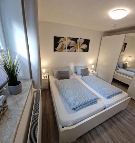 a bedroom with a large bed in a room at Strandschnecke 2 in Scharbeutz