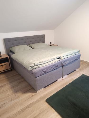 a bed sitting in a room with at Gästehaus am Schlossberg in Friedenfels