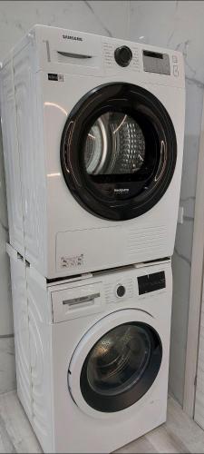 a washer and dryer stacked on top of each other at b&b al lago Mady in Avigliana