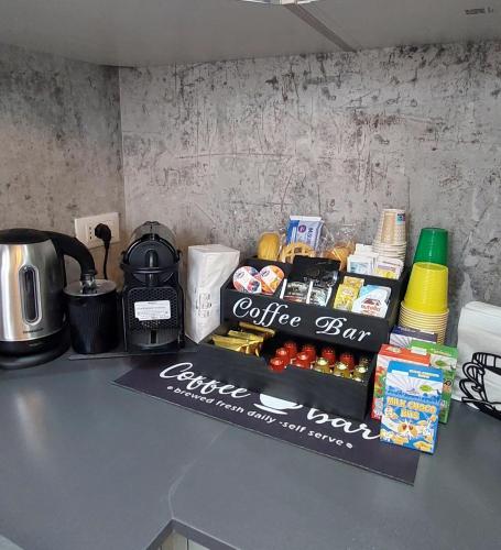 a counter top with a coffee bar on it at b&b al lago Mady in Avigliana