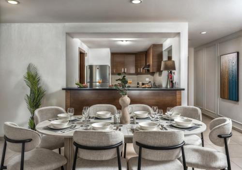 a dining room with a table and chairs at Desert Key - Platinum Apartments in Gate Tower, Al Reem Island in Abu Dhabi