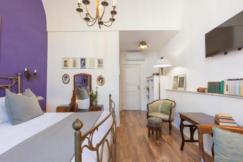 a bedroom with a bed and a table and chairs at 900 - Guest House in Livorno
