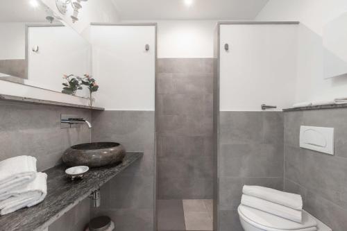 a bathroom with a toilet and a sink at 900 - Guest House in Livorno