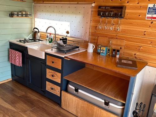 a kitchen with a sink and a stove at Dew Pond in Blagdon