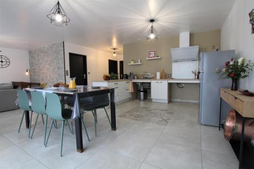 a kitchen and dining room with a table and chairs at Barrandeia in Juxue