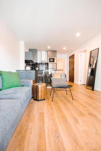 a living room with a couch and a table at Apartamento Porta14 1 in Chaves