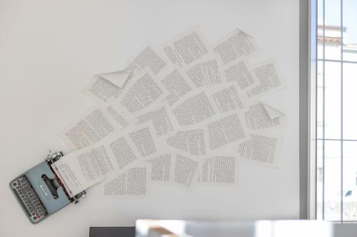 a wall with a picture of houses on a wall at 900 - Guest House in Livorno