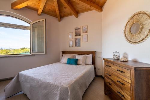 Ένα ή περισσότερα κρεβάτια σε δωμάτιο στο Sa Domu Pitticca