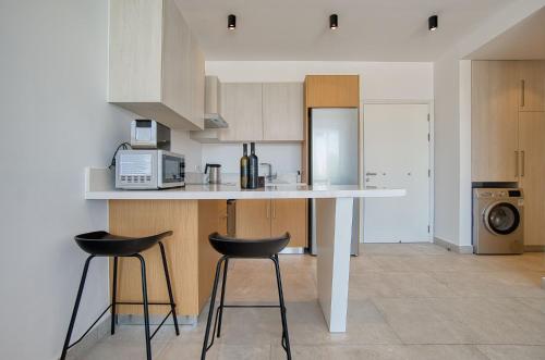 Avenue 202 1 BED tesisinde mutfak veya mini mutfak