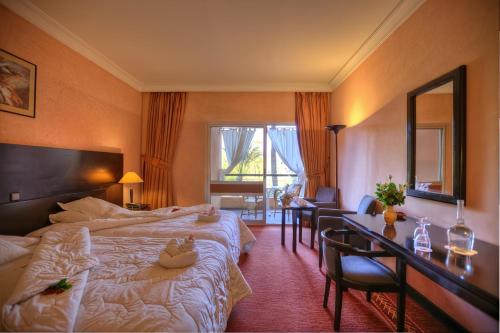 Postel nebo postele na pokoji v ubytování Hôtel Le Semiramis Marrakech by Bravia Hotels