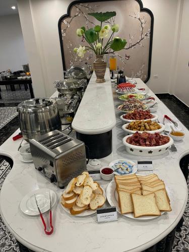 a table with a bunch of different types of food at Kana Boutique Hotel Ninh Bình in Ða Gia