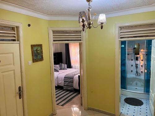 a bedroom with a bed and a chandelier at Benja holiday home in Katale