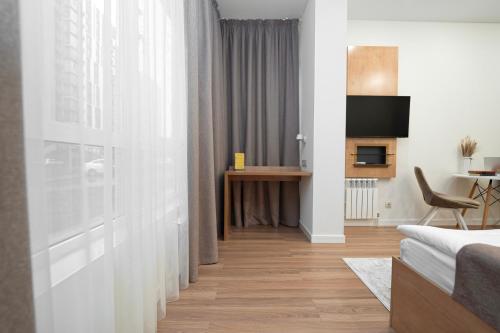 Μια τηλεόραση ή/και κέντρο ψυχαγωγίας στο Q Apartment