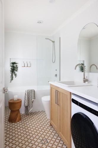 a bathroom with a sink and a toilet and a tub at Luxury Montville getaway for up to 12 guests in Montville