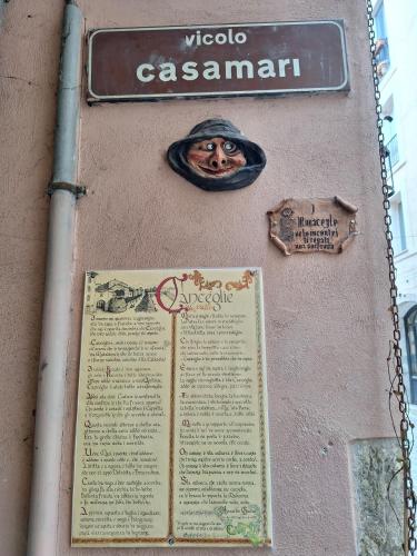 a sign on the side of a building with a sign at Casa Napoleone in Sora