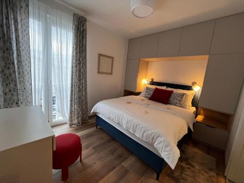 a bedroom with a large bed and a large window at Apartment Nona Celina in Zadar