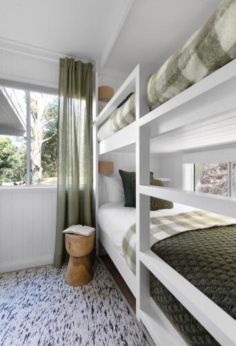 a bedroom with two bunk beds and a window at Luxury Montville getaway for up to 12 guests in Montville
