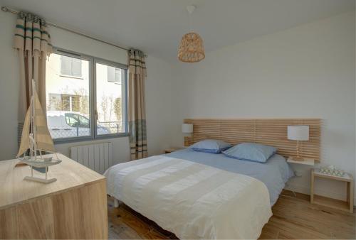 Postel nebo postele na pokoji v ubytování Maison de l'Aiguillon