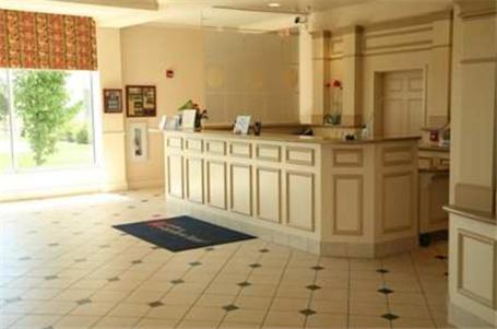 a large kitchen with a counter in a room at Hilton Garden Inn Grand Forks/UND in Grand Forks