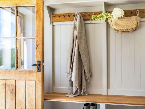 a towel hanging on a door in a room at 4 Bed in Chirk 87675 in Chirk