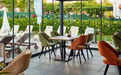 a dining room with a table and chairs at Arancini Residence in Vodice