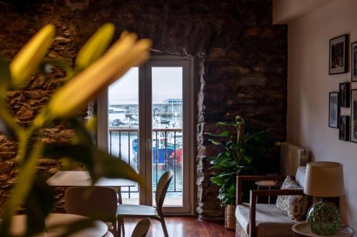a living room with a window and a balcony at Katrapona in Getaria