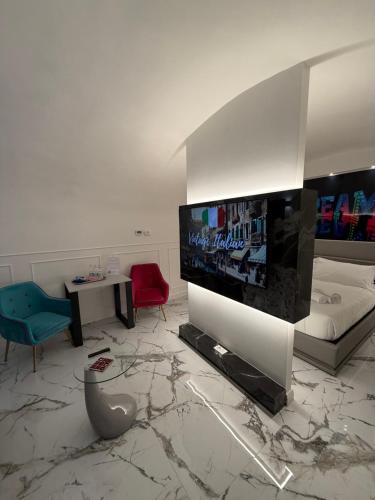 a living room with a large flat screen tv at Amor Aeterna Domus in Rome