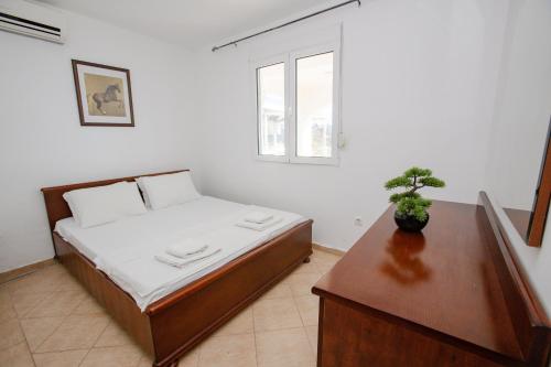 Aleksandra Apartments Utjehaにあるベッド