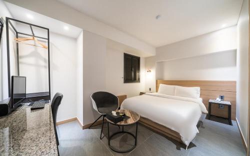 Postel nebo postele na pokoji v ubytování HOTEL MYEONG JAK