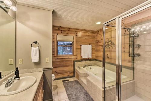 a bathroom with a tub and a sink at Carolina Moon Cabin in Franklin