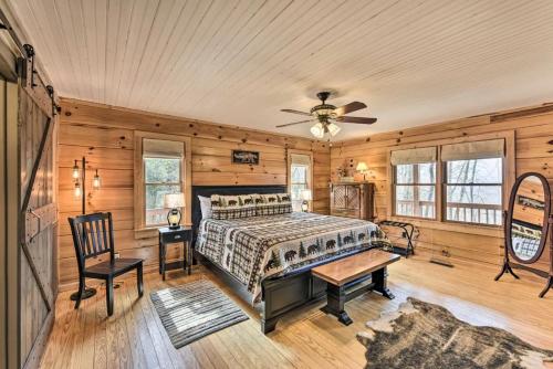 a bedroom with a bed and a ceiling fan at Carolina Moon Cabin in Franklin