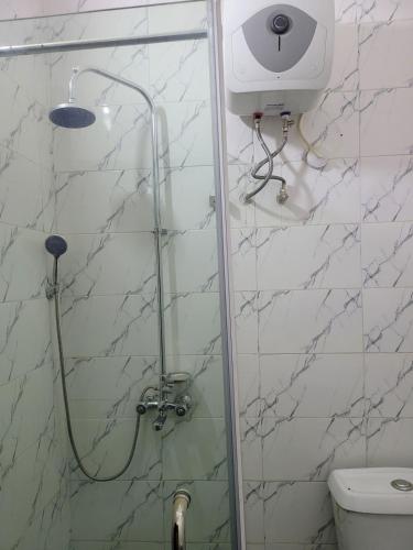 a shower with a glass door in a bathroom at Nice and Cozy 1 Bed & Parlour with Starlink Wi-Fi , PlayStation, Netflix, Smart Door, 24 Hours Power, Great location in Wupa