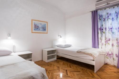 Ένα ή περισσότερα κρεβάτια σε δωμάτιο στο Villa Mare & Filip