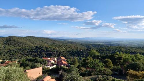 an aerial view of a village in the hills at LOFT L'Olivier in Llauro