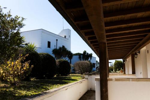 a view of a building from the porch of a house at Masseria Fabrizio in Otranto