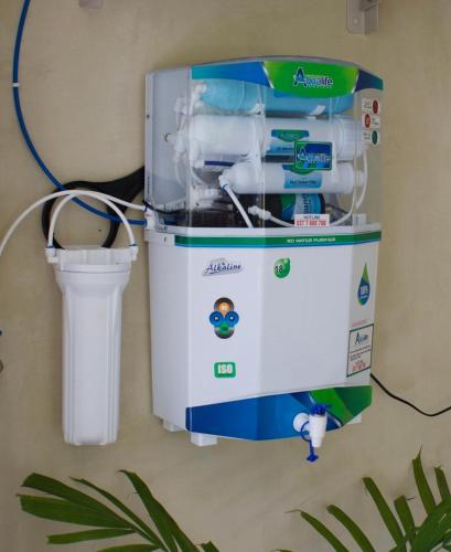 a water heater on the wall with a trash can at Dannys Madiha in Godakanda