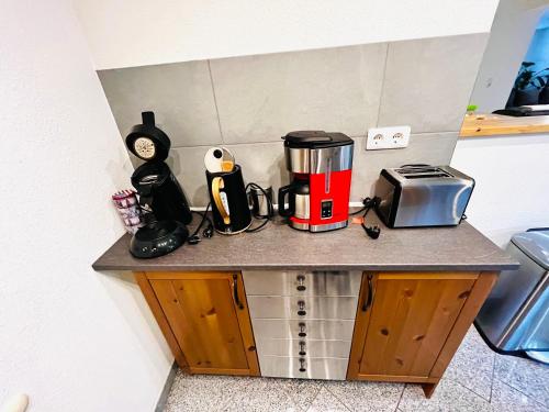 a kitchen counter with a coffee maker and a toaster at Kinderparadies Alt Lüxem in Wittlich
