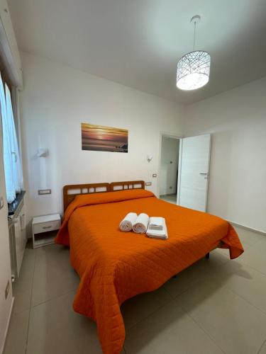 a bedroom with a bed with two towels on it at CASA VACANZE CASANOVA in Agerola
