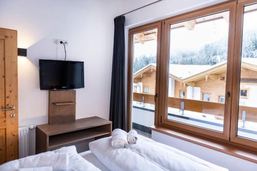 Postel nebo postele na pokoji v ubytování Residence Zillertal